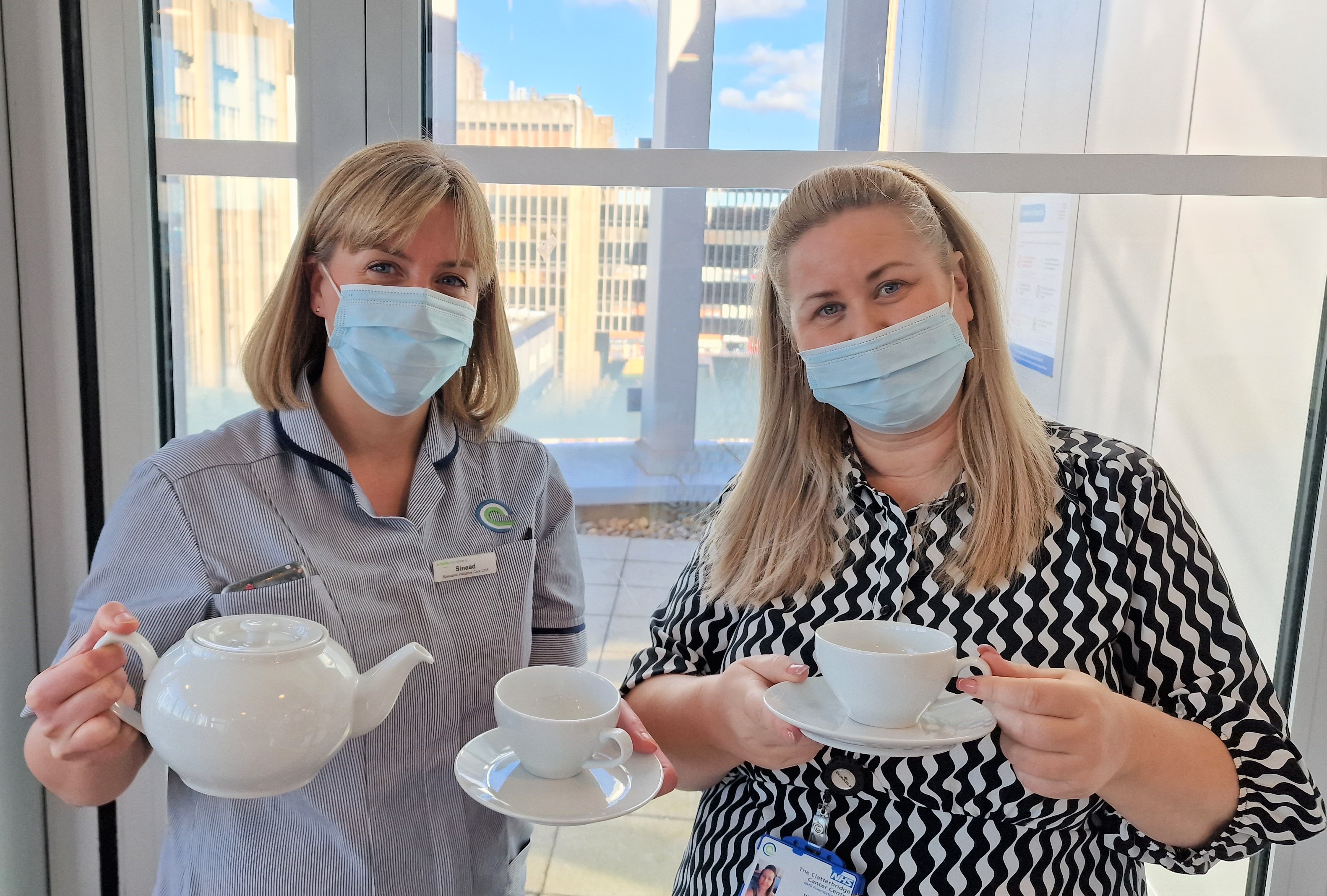 Sinead Benson is pictured left with Michelle Downer, Acute Care Admin Support and Cancer Support Worker, and one of the tea sets.