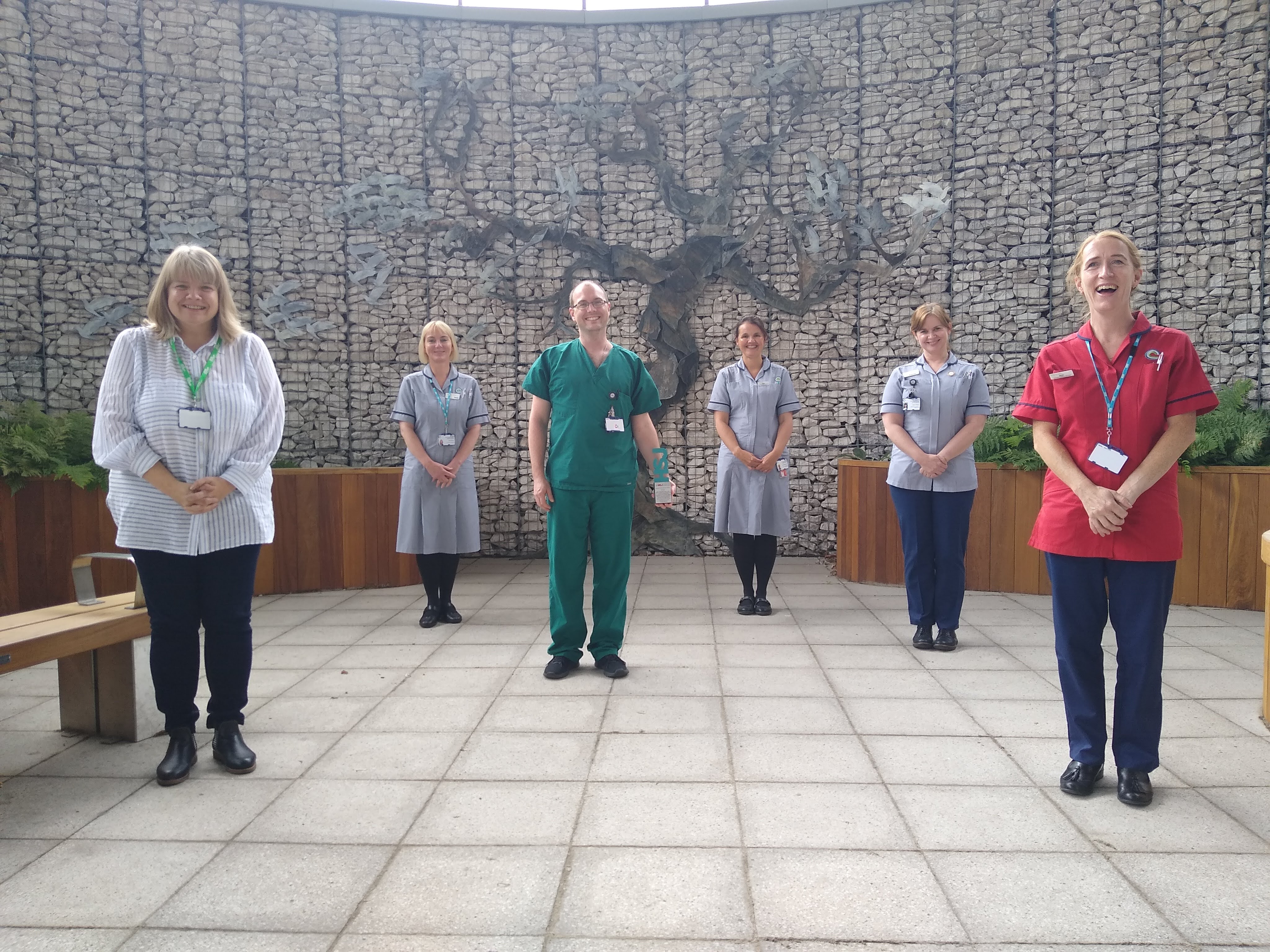 Members of the Enhanced Supportive Care (ESC) team pictured with their HSJ Value Award in the Winter Garden at Clatterbridge Cancer Centre - Liverpool