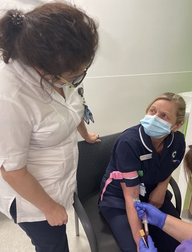 Clatterbridge staff give a blood sample to the biobank