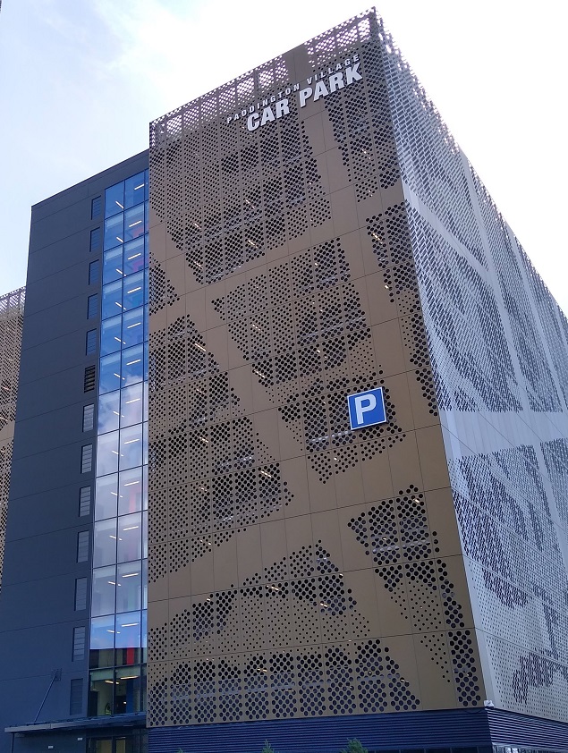 Picture of Paddington Village Car Park. It's a tall bronze building.