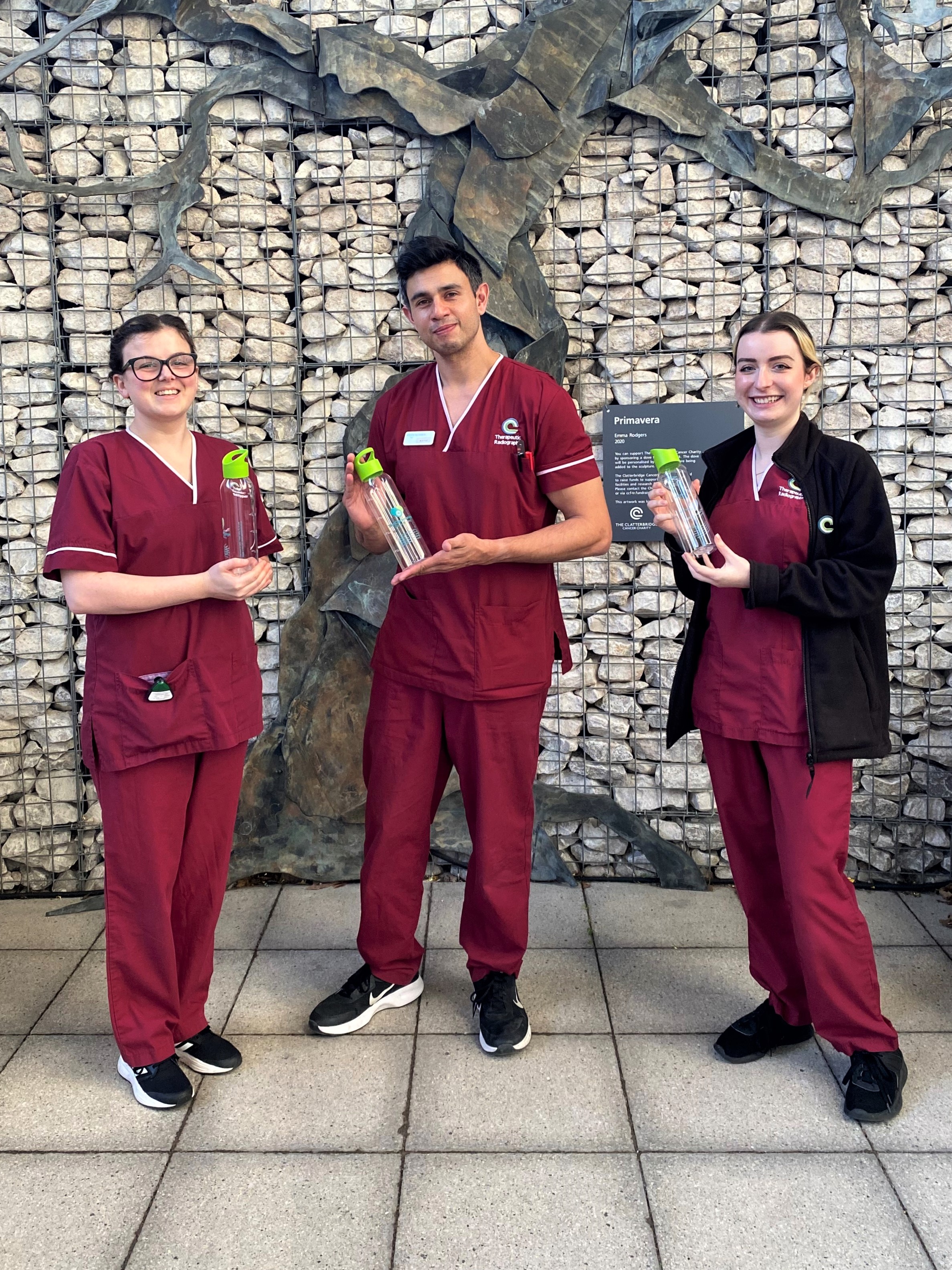 Clatterbridge staff holding the water bottles